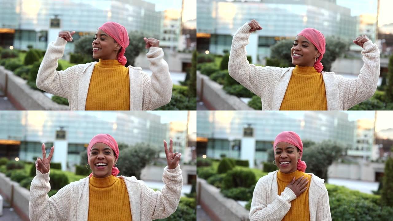 年轻的癌症妇女，乳腺癌幸存者，非洲裔美国人，用粉红色手帕象征着抗癌的视频肖像