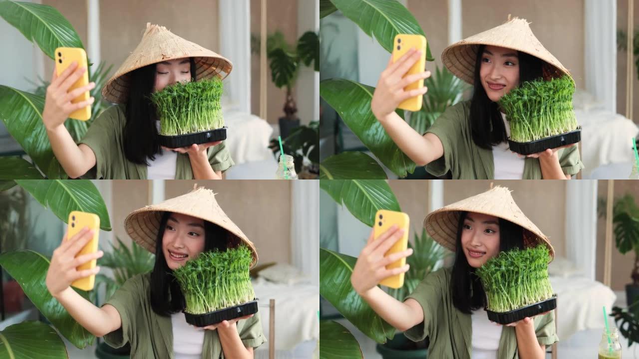 传统帽子制作蔬菜水果和微绿芽菜沙拉的美丽亚洲女性博客