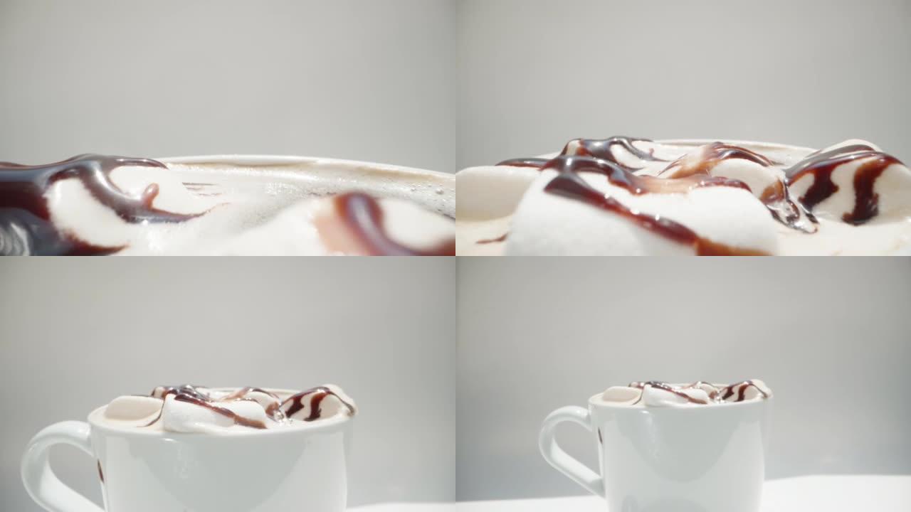 棉花糖倒入咖啡杯中的巧克力漂浮物。摄像机穿过它。白色背景。多莉滑块极限特写。