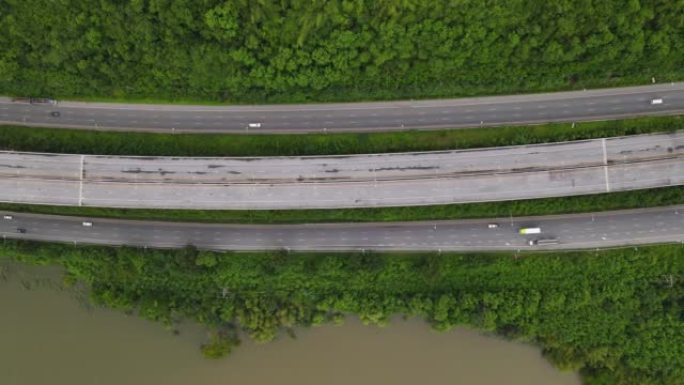 城市之间的高速公路连接，鸟瞰图，高角度视图，高速公路的高架镜头穿过湖泊和山脉