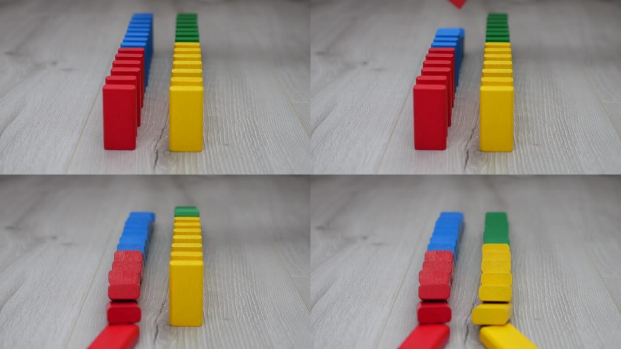 儿童木制玩具块在多米诺骨牌效应中掉落。慢动作。