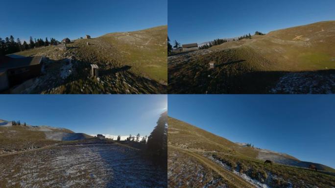 鸟瞰图运动FPV无人机在风景如画的丘陵地形上极端动态飞行
