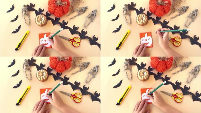 为万圣节假期创建儿童纸装饰花环。