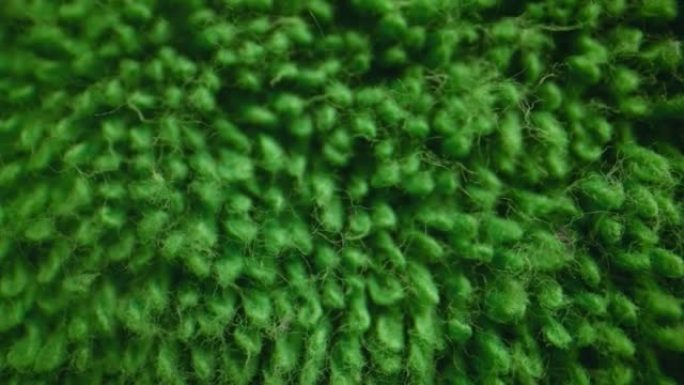 绿色柔软毛巾布纺织品的质地。