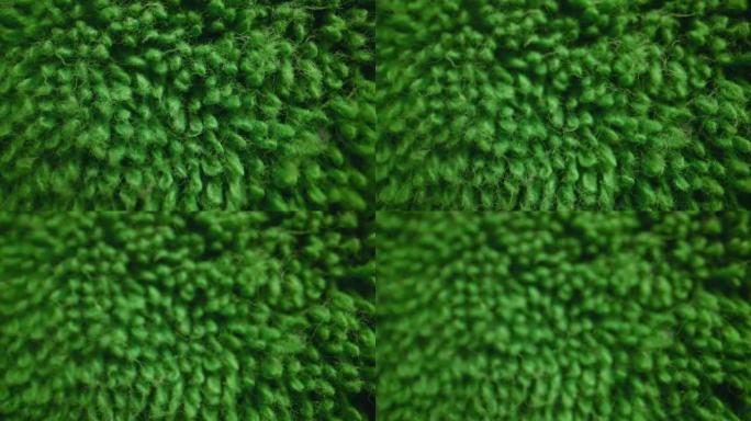 绿色柔软毛巾布纺织品的质地。
