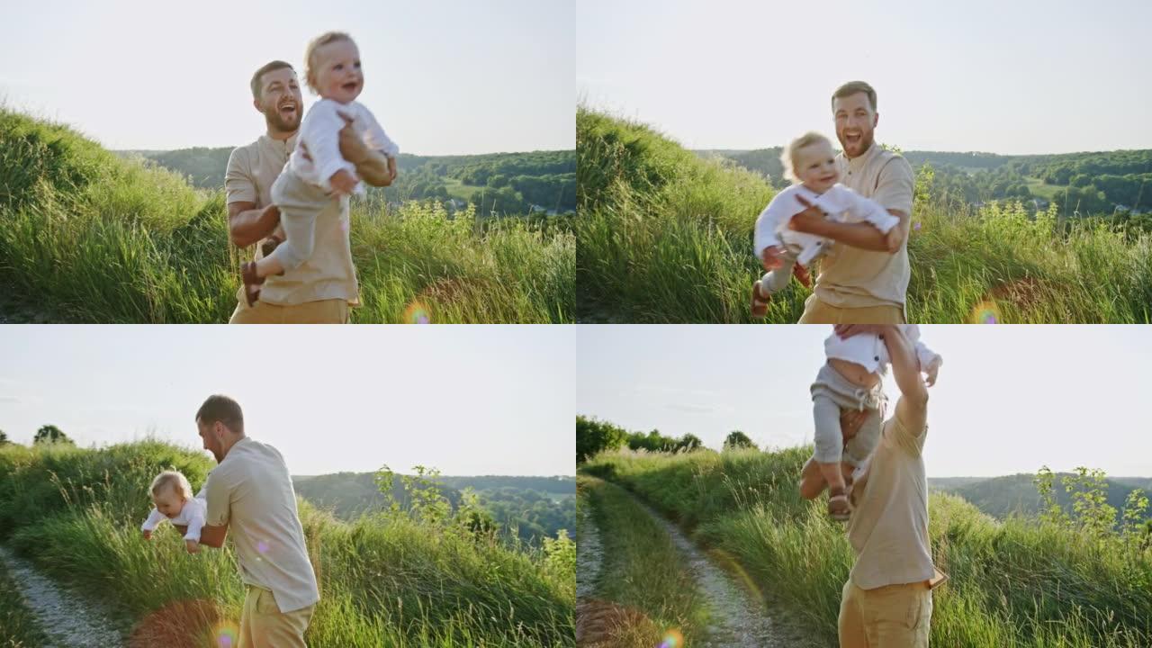 快乐而自豪的年轻父亲抱着他的笑意婴儿在户外的户外，阳光照耀着他的手臂