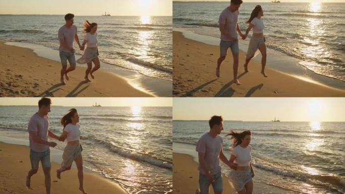 年轻的情侣在日落时在海滩上跑步很开心
