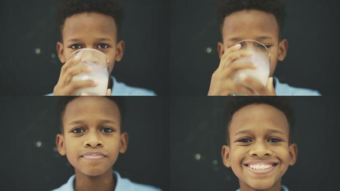 十几岁的男孩从杯子里喝牛奶