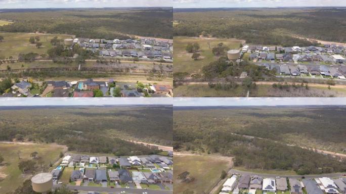 澳大利亚新南威尔士州西南悉尼Voyager Point的空中无人机视图，驶向火车线和希思柯特路