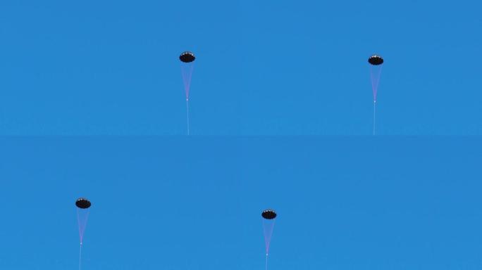 高清镜头，黑色小降落伞在清晰的蓝天背景下