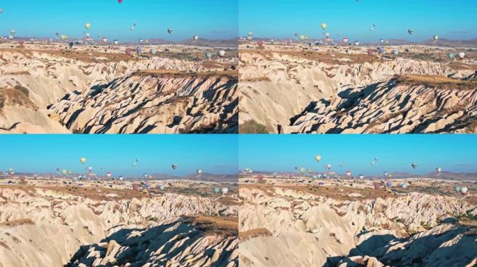 卡帕多西亚空中的热气球群山体贫瘠嶙峋