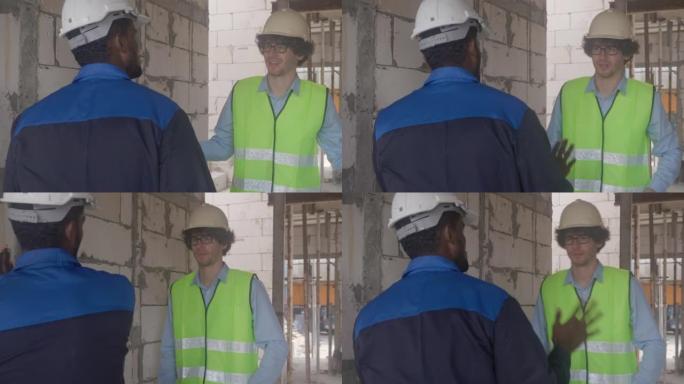 建筑师和建筑商在施工现场交谈和检查员施工，承包商和工人讨论和规划有关房地产，工程师概念的进度基础设施