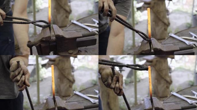 用铁锤在铁匠铺上关闭铁匠加工金属