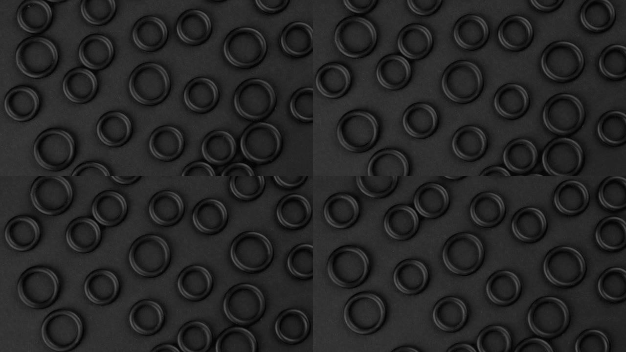 黑色圆形橡胶密封垫片的抽象俯视图