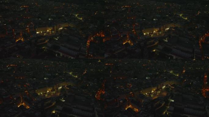 晚上但丁广场的空中幻灯片和平底锅镜头。市中心道路交通的高角度视图。意大利那不勒斯