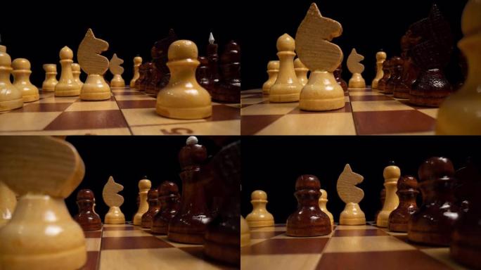 一个在棋盘上的白色木制象棋皇后的近景摄影摄影。流畅的相机运动上面的棋盘与黑白棋子。黑色背景。