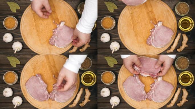 男性的手把肉块放在木板上。厨师把肉排放在砧板上的排骨上腌制。木桌上的大蒜，芥末，姜，橄榄油，香料。顶