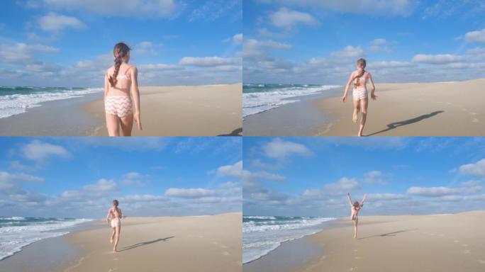 一个长发的少女沿着大西洋海岸奔跑，跳得很高。一个孩子在海滩上玩耍的全高清慢动作视频。