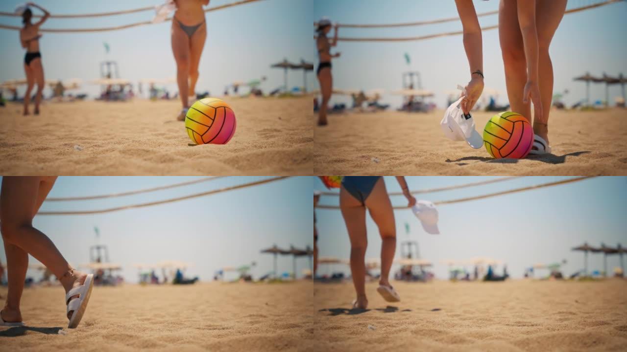 一个年轻女孩在沙滩上捡球
