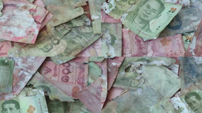 镜头4K。现金，泰国纸币，破损，撕裂，破损，流通货币，泰铢是泰国的官方货币。