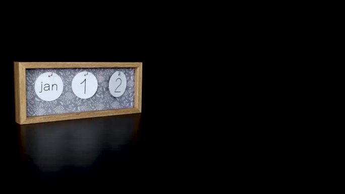 一个木制日历块，用男人的手1月12日和取下带有日期和月份的金属盘，以4k质量拍摄
