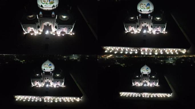 无人机拍摄的G20标志夜间在印度首都新德里的联合国教科文组织世界遗产胡马云墓上投影的画面
