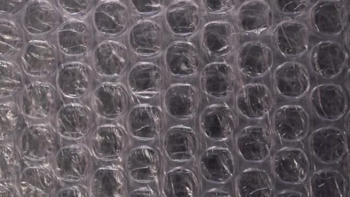 包装气泡包装。聚乙烯包装薄膜的幻灯片拍摄。