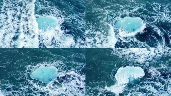 海洋中的冰山，巨块蓝色的冰漂浮在海浪上，北极景观的鸟瞰图，干净的水，全球变暖和气候变化的概念