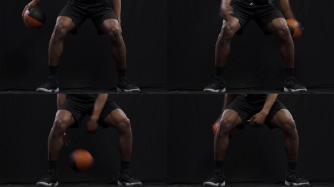 篮球运动员跳球。非裔美国运动男子在黑色背景下练习 ..