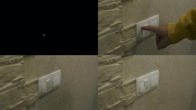 这个人打开灯-按下墙上的按钮。