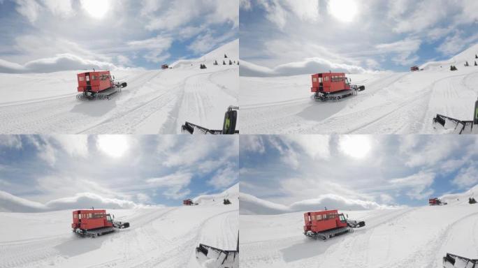 扫雪机救援拖拉机在暴风雨过后在山上快速行驶，慢动作