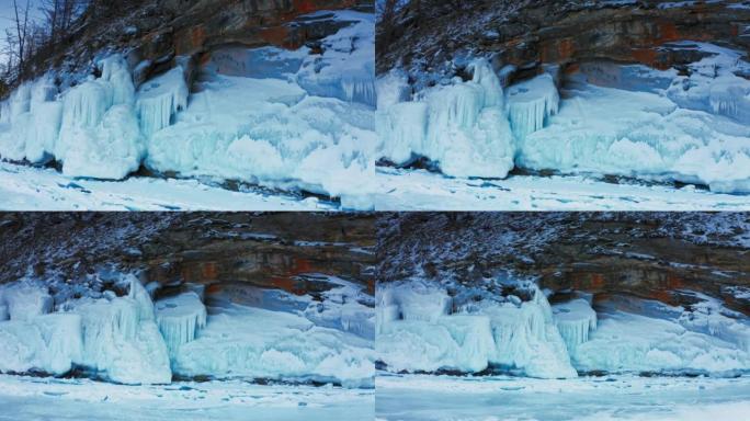贝加尔湖，一块岩石上的大块冻冰。一种罕见的自然现象。俄罗斯西伯利亚贝加尔湖。空中无人机射击4k
