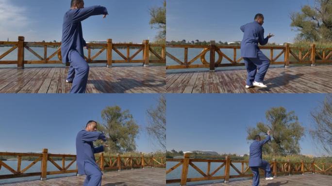 武术大师在湖边练习太极拳。