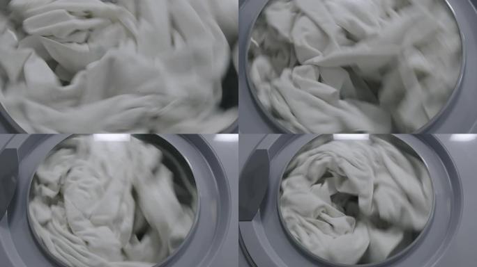 白色亚麻在洗衣机中旋转