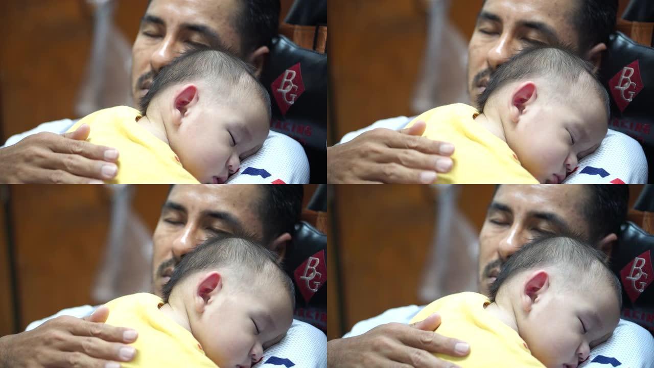 新生儿子睡在父亲的胸口