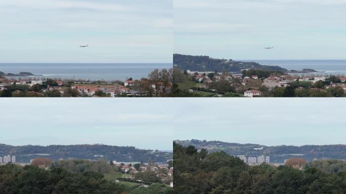 远处一架飞机接近亨达耶机场。这段视频是在飞机从海上降落到飞往机场的途中飞行的。