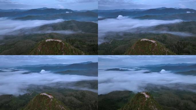 空中无人机拍摄了早晨有大量雾和薄雾的热带雨林，空中无人机观看了观点的日出场景Kunung Seipa