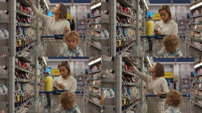 买家在超市的货架上选择产品的女孩。买方检查罐装食品的产品。一只手从商店货架上拿起产品