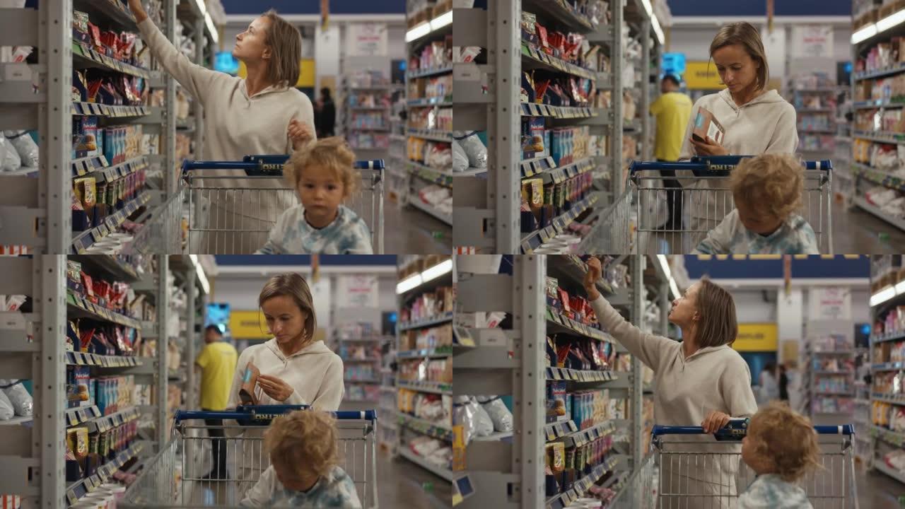 买家在超市的货架上选择产品的女孩。买方检查罐装食品的产品。一只手从商店货架上拿起产品