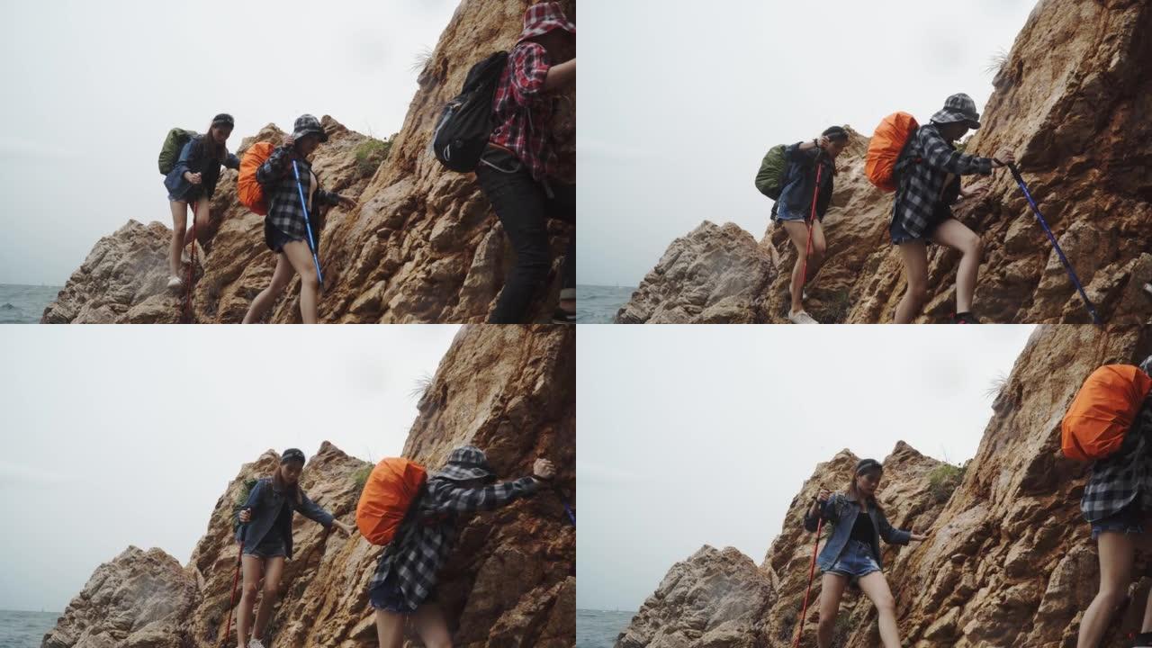 一群徒步旅行者爬上岩石。