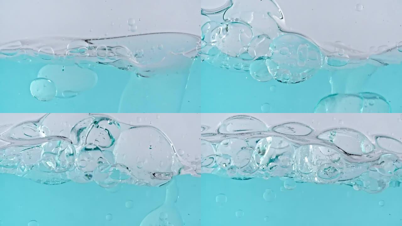 浅白色背景上上升的水中各种气泡的宏观拍摄。液体奶油凝胶透明化妆品样品质地与气泡。清洁和纯洁的概念。慢