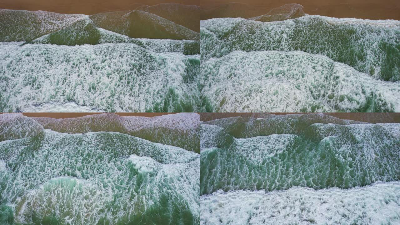 太平洋海浪在沙滩上破裂的鸟瞰图