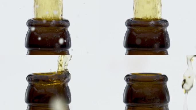 流淡啤酒从瓶颈飞溅在超慢动作特写。