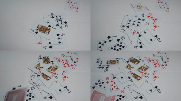 扑克牌落在白桌上