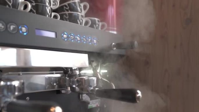 Coffee machine with steam in the process.