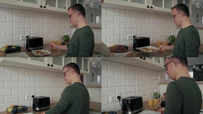 患有唐氏综合症的成年白人男子准备并将早餐传递给他的妈妈。用8k的红氦相机拍摄。