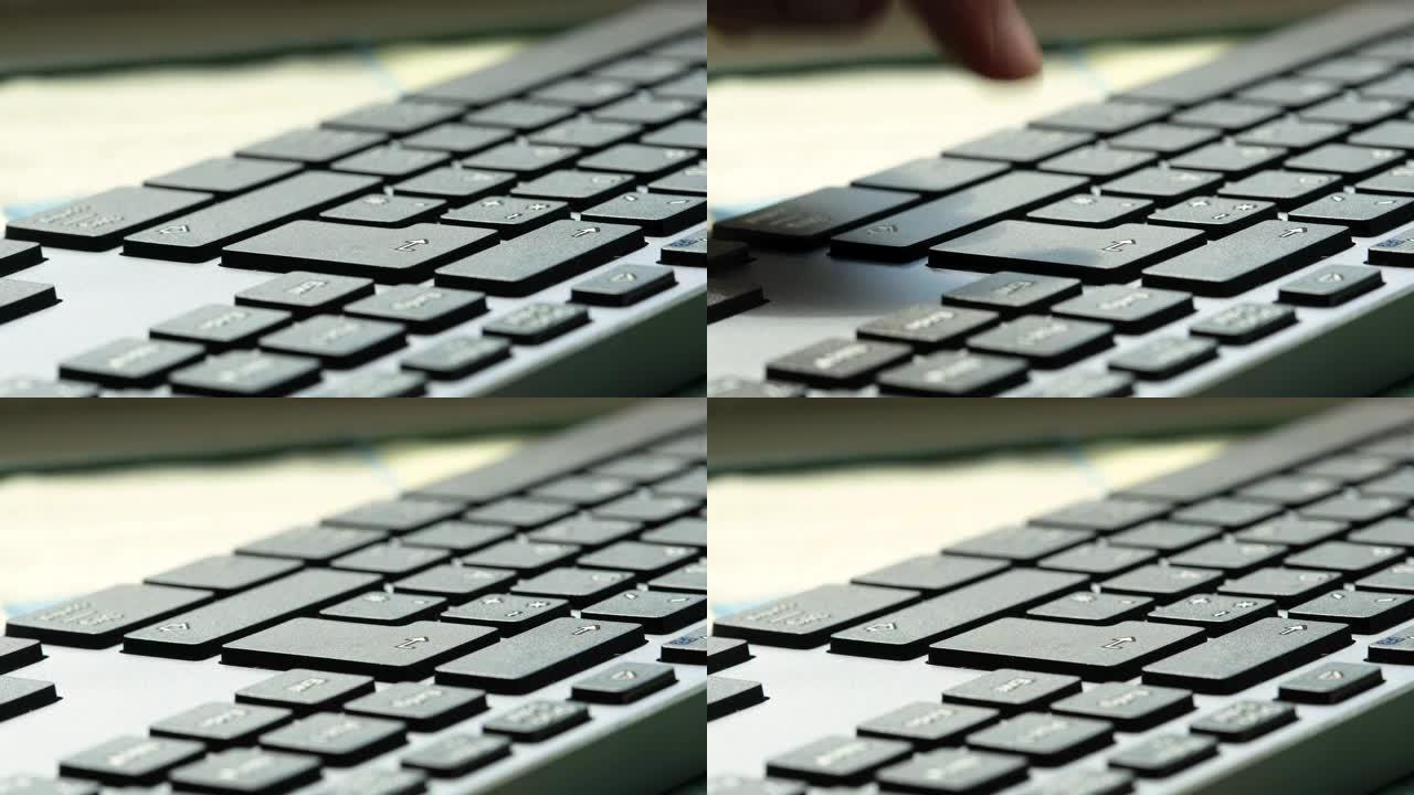 男人在现代计算机键盘上按enter键侧视图，细节，极端特写，慢动作。确认，接受，购买物品，采取行动在