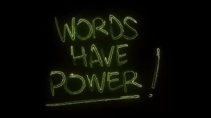 黑色背景上发光的霓虹灯文本字母 “单词有力量”。