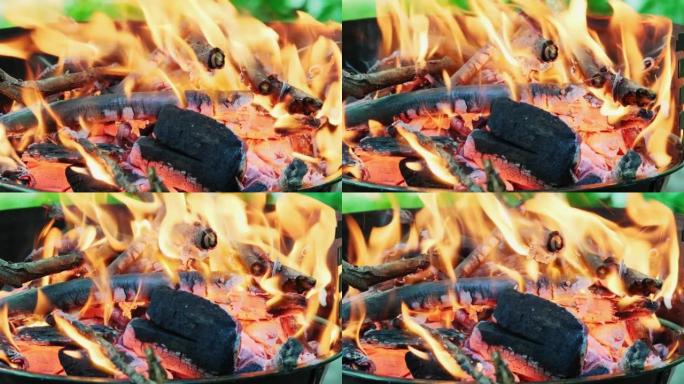 烧烤炉篝火中燃烧木炭的火焰