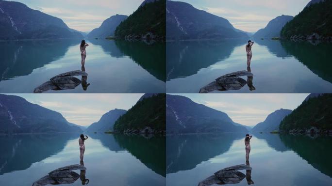妇女在挪威的山湖中游泳